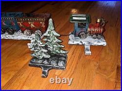 3D cast iron Santa train set with 6 Christmas stocking holders with trees HTF
