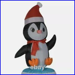 Holiday Time 5.5ft Animated Spinning Penguin on Igloo Scene Airblown Inflatable