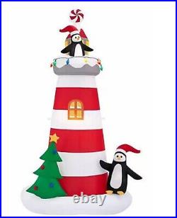 Home Accents Holiday 7.5 FT LED Lighthouse with Beacon and Penguins Holiday Infl